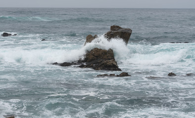 waves crashing on rocks