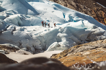 Private group of hiker walking on glacier. Glacier group of people hiking mountains