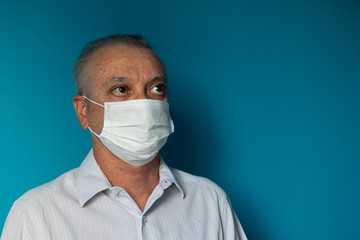 Recife / Pernambuco / Brazil. March, 20, 2020. Images of a 54-year-old middle-aged male model wearing protective hospital masks and gloves. Protection against Covid-19.