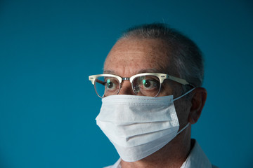 Recife / Pernambuco / Brazil. March, 20, 2020. Images of a 54-year-old middle-aged male model wearing protective hospital masks and gloves. Protection against Covid-19.