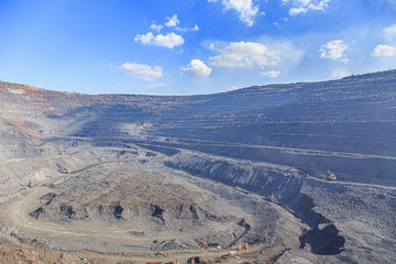 Fototapeta na wymiar Panorama of iron ore quarry on a sunny day
