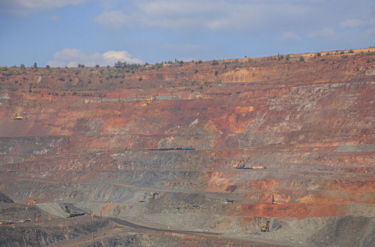 Panorama of iron ore quarry on a sunny day
