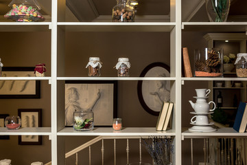 Light shelf with cans, dishes and various items