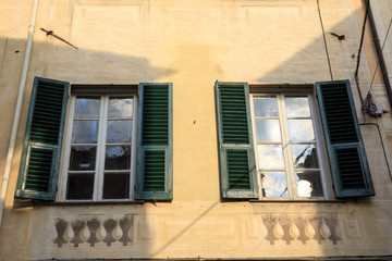 Fototapeta na wymiar Finalborgo (SV), Italy - December 12, 2017: A typical windows in Finalborgo village, Finale Ligure, Liguria, Italy