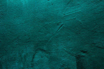 Petrol colored wall texture background with textures of different shades of petrol also called teal