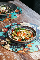 Salad with pine nuts and tomatoes. Vegetarian vegetable salad. European cuisine.