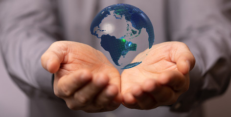 Human Hand Holding The World In Hands.