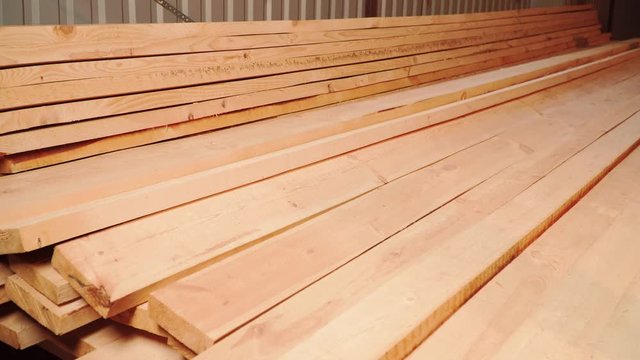 Long wooden boards are in stock in sawmill