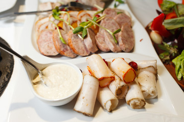 Appetizers in the form of lard and other dishes on the celebration table