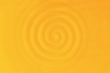 Ceramic dish, circular vibrations. Soft orange yellow rippled waves. Warm background
