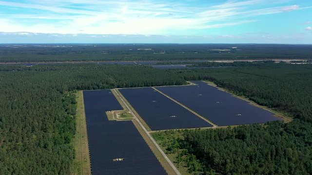 Drone footage panoramic shot of solar power station build on former airport field in Templin, Germany