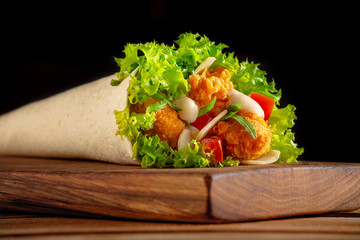 delicious wrap with crispy chicken and parmesan cheese