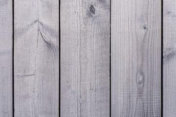 The faded surface of wooden boards