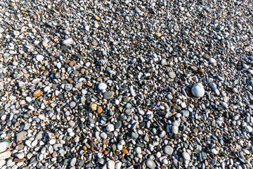 beautiful background of pebbles on the beach of the Mediterranean sea near Kemer, Turkey