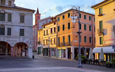 Bassano del grappa Italy. Square freedom. Landscape old town with italian architecture and street lamp. Sunrise at deserted street.