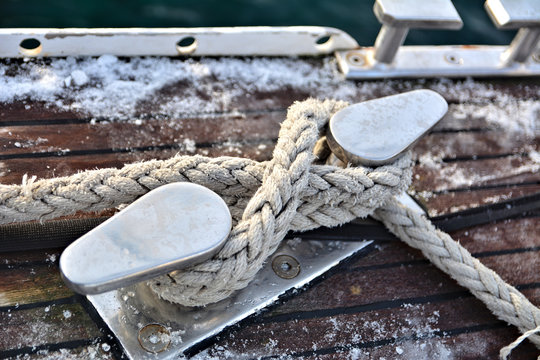 A cleat with a black stern hawser