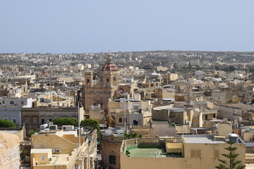 RABAT, MALTA - August 2018: High View Maltese church architecture, old houses and narrow streets, Rabat, Mdina, Malta