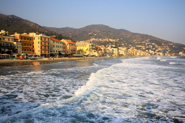 Obraz premium Alassio (SV), Italy - December 12, 2017: Alassio view's town from the pier, Riviera dei Fiori, Savona, Liguria, Italy
