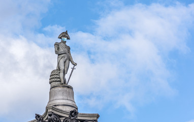 Statue of Admiral Nelson in London wearing a face mask as a symbol of the London and UK lockdown...