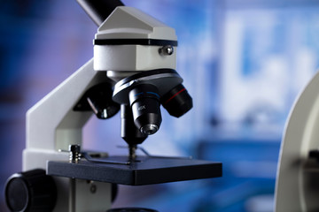Modern scientific laboratory interior. Reaserch station with microscopes on the glass table.