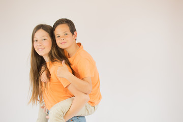 Fototapeta premium Boy and girls are looking into the camera