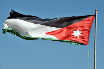 The flag of Jordan blowing in the wind