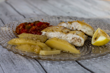 Photo by hake dish with baked potatoes