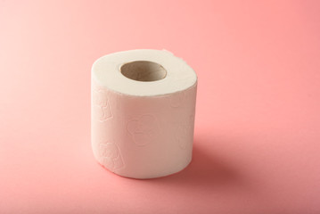 A napkin or roll of toilet paper on a yellow background with a copy of the space to wipe clean.