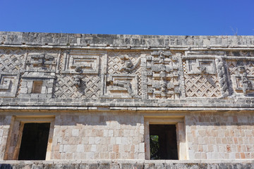 Fototapeta premium Uxmal, Mexico: Carvings on a building in Uxmal, a major Mayan city, 600-900 A.D.