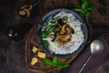 Italian dish risotto with mushrooms and herbs.
