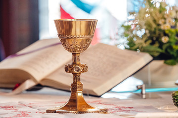 Chalice in front of bible at church
