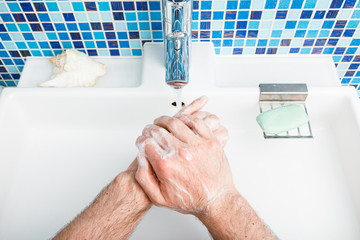 Man washing hands protective measures against coronavirus epidemy