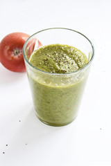 Mixed green smoothie with apples on a white background