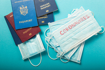 Coronavirus and travel concept. Note COVID-19 coronavirus and passport.  Border control and...