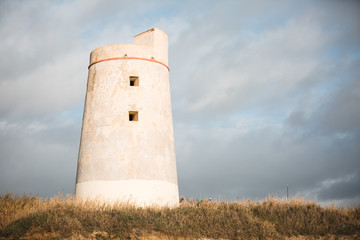 Fototapeta na wymiar Abandoned Lighthouse of El Palmar de Vejer, Cadiz, Andalusia Spain
