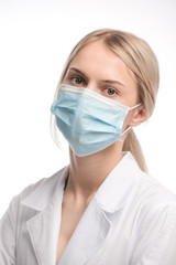 young beautiful girl with blond hair in a medical mask. On white background. Coronavirus