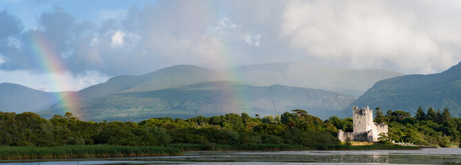 Killarney lakes and Ross Castle  panorama landscape, double rainbow  rain skies