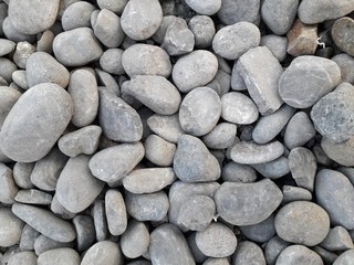 Collection of gray river stones. Good for background and more.