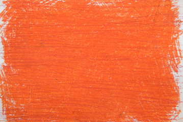 orange vax crayon on white paper background texture