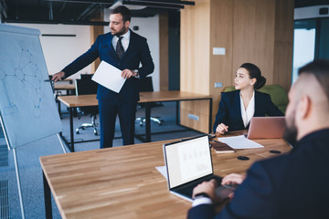 Executive showing diagram to colleagues