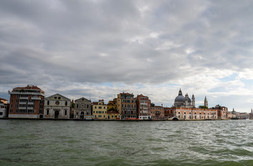 Fototapeta na wymiar Beautiful view to Venice from the sea boat. Italy, Europe. Traditional italian architecture full of historical buildings and bridges 