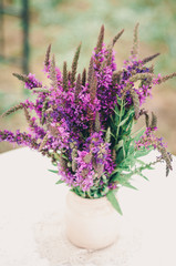 Beautiful bouquet of bright wildflowers with decorative elements