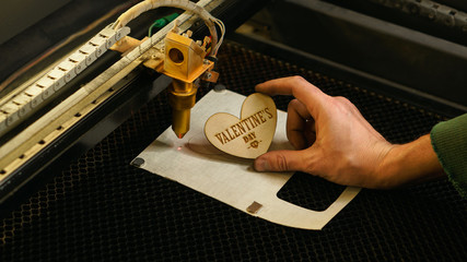 Laser cutting beam high precision on a plywood sheet. Modern technology of wood cutting. laser cut...