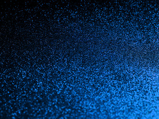 Festive classic blue color of 2020 year metallic glitter abstract background with bokeh lights