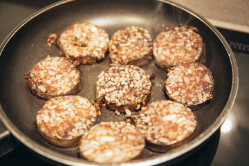 Frying pan frying pork blood sausage during quarantine
