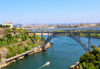 Fototapeta na wymiar View of Douro river and Dom Luís I Bridge (Porto, Portugal)