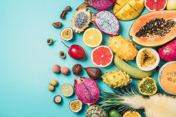 Tropical fruits concept. Exotic fruits - pineapple, papaya, mango, annona, banana, pitahaya, kiwano, african horned melon, tamarillo fruit, granadilla, salak, snake fruit, maracuya, rambutan, lychee