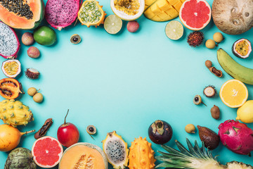 Tropical fruits concept. Exotic fruits - pineapple, papaya, mango, annona, banana, pitahaya,...