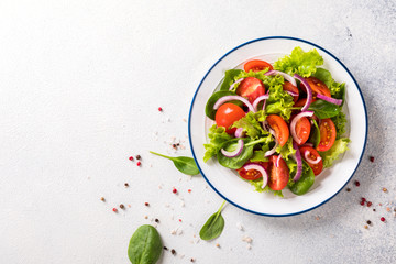 Green vegan salad from vegetables and  green leaves mix.