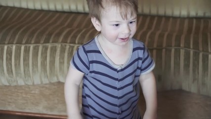 Boy drums on a fitness ball
